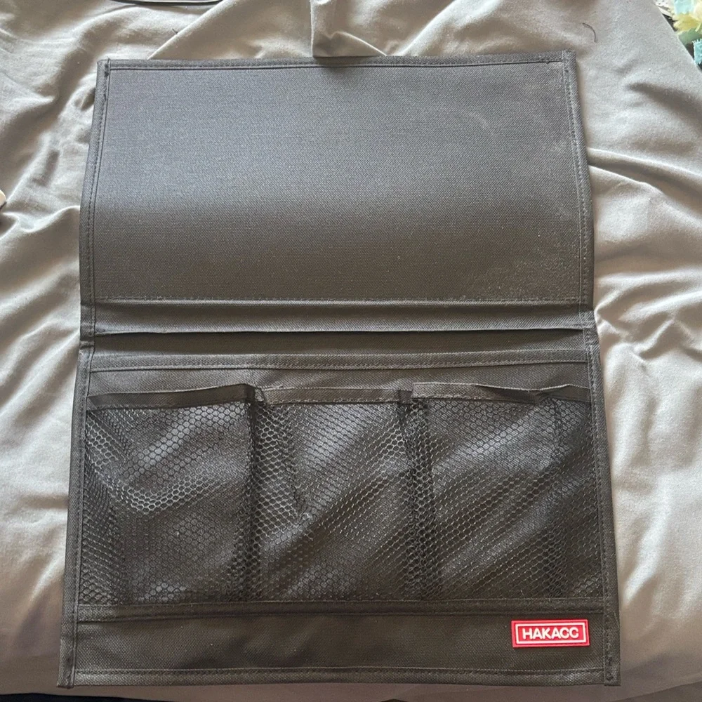 Black Travel Organizer Pouch bedside